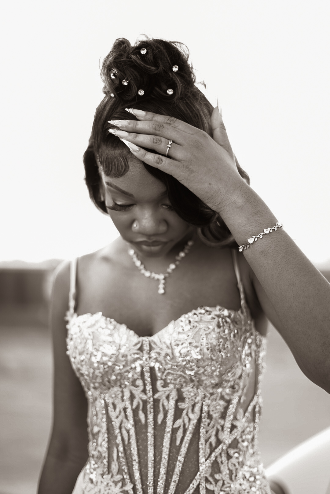 Professional black and white prom portrait by Dev’s Direction in Virginia Beach, featuring a student in a detailed sequined gown with elegant hair styling and jewelry.